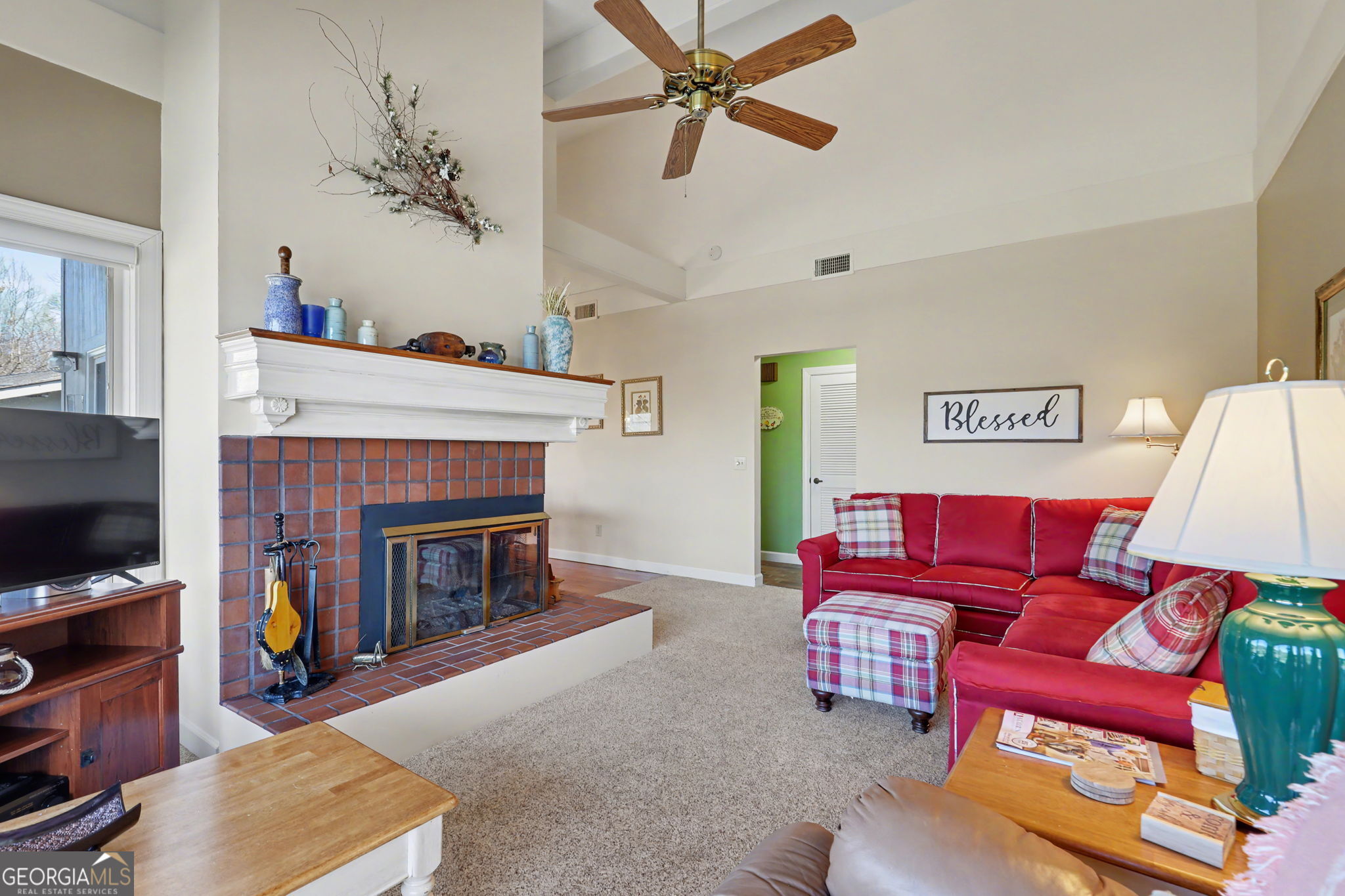 62 Sunvalley Circle, Unit 7006 Dillard, GA 30537 - Photo 9 of 55 a living room with furniture and a fireplace