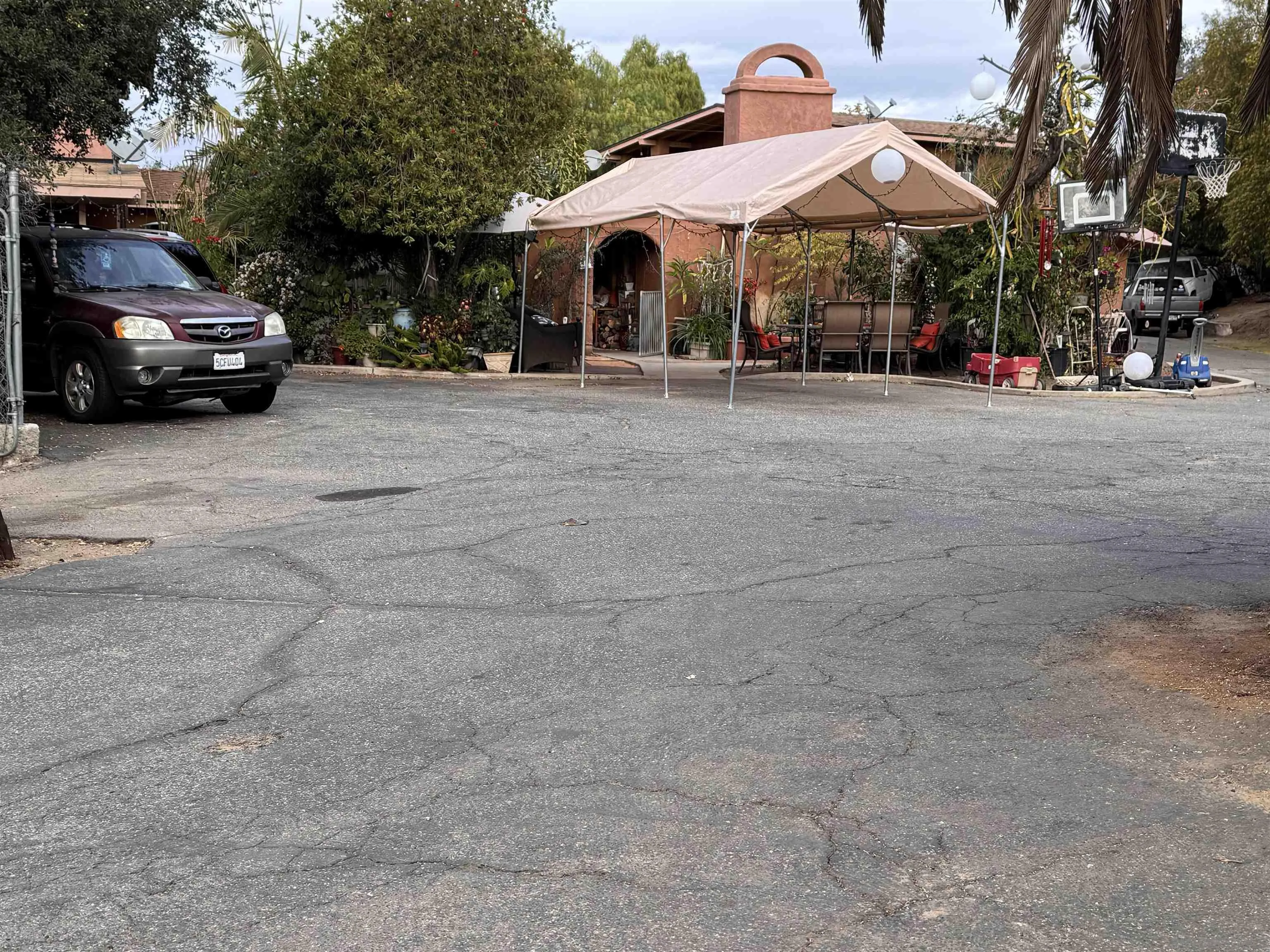 1708 East Mission Road Fallbrook, CA 92028 - Photo 11 of 13 a car parked in front of a building
