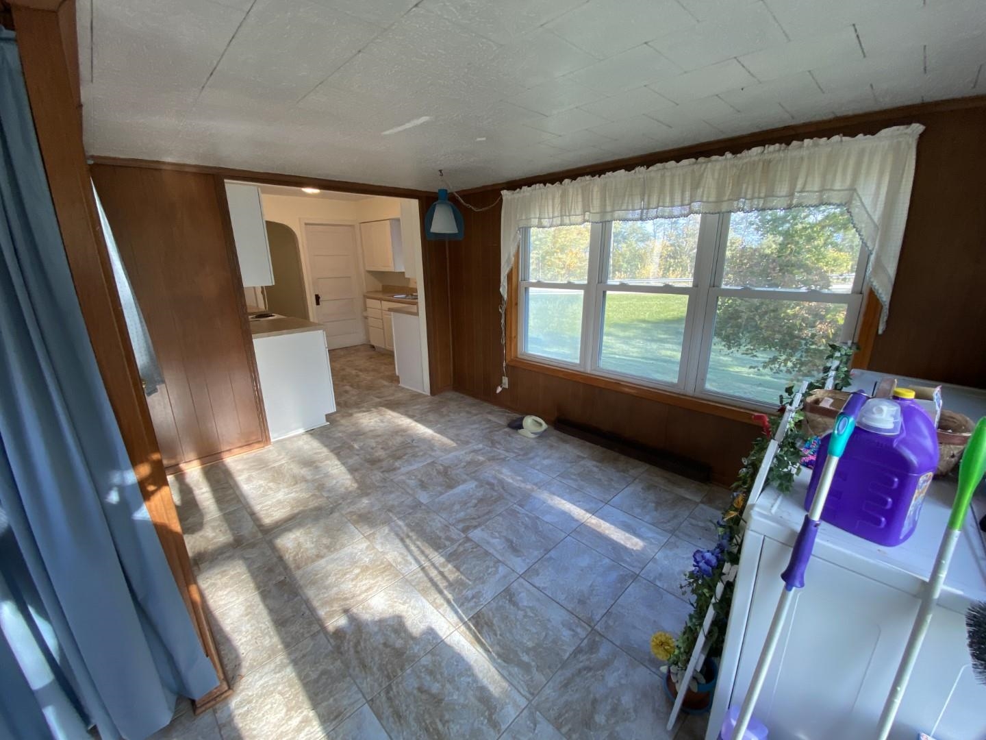 10361 Becker Road Savanna, IL 61074 - Photo 16 of 23 a bed room with a bed and a window