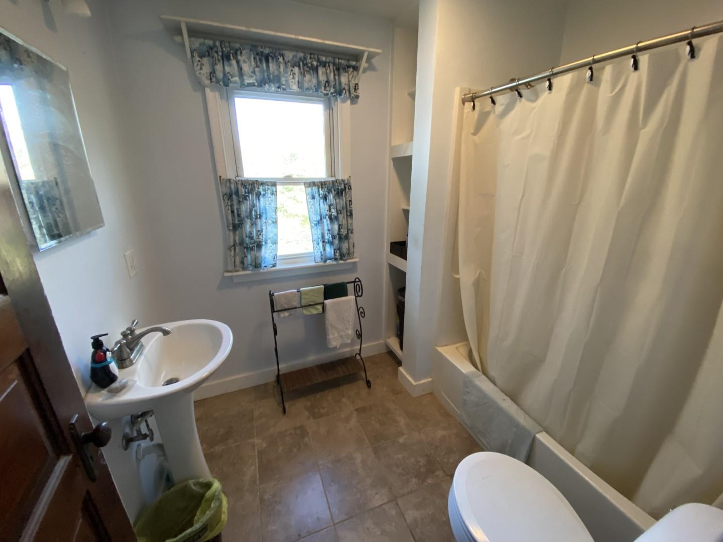 10361 Becker Road Savanna, IL 61074 - Photo 17 of 23 a bathroom with a sink toilet and shower