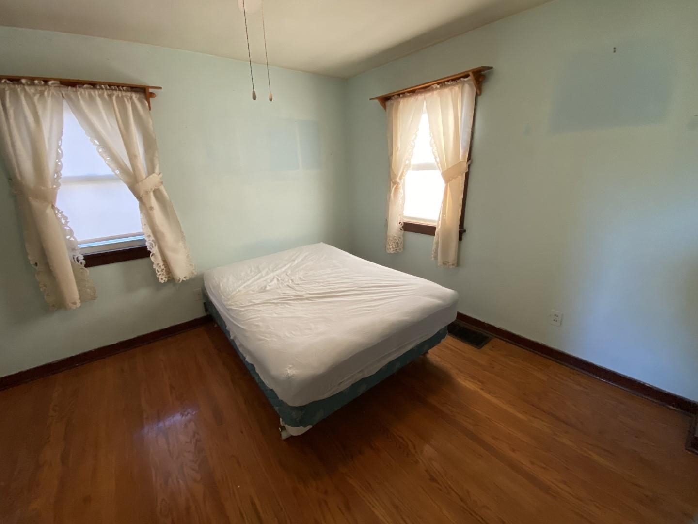 10361 Becker Road Savanna, IL 61074 - Photo 18 of 23 a bedroom with a bed and a window