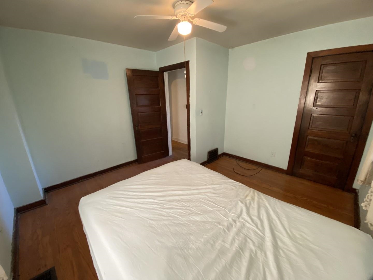 10361 Becker Road Savanna, IL 61074 - Photo 20 of 23 a bedroom with a bed and a mirror