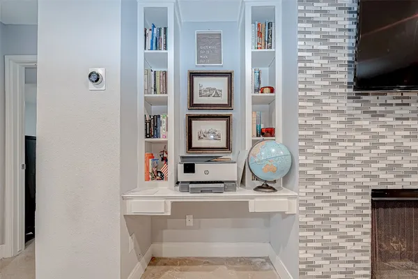 a kitchen with stainless steel appliances granite countertop white cabinets and a sink