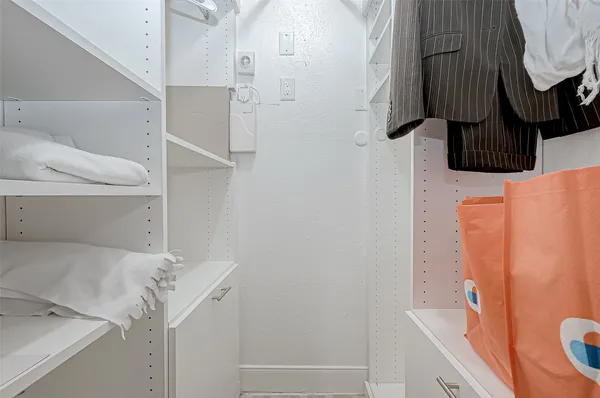 a bedroom with a bed and a closet