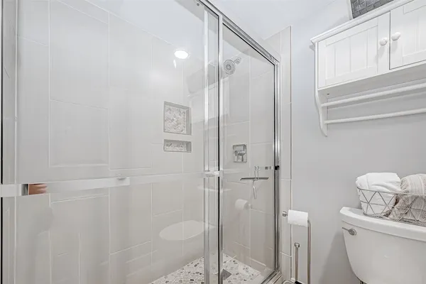 a bathroom with double vanity sinks and a mirror