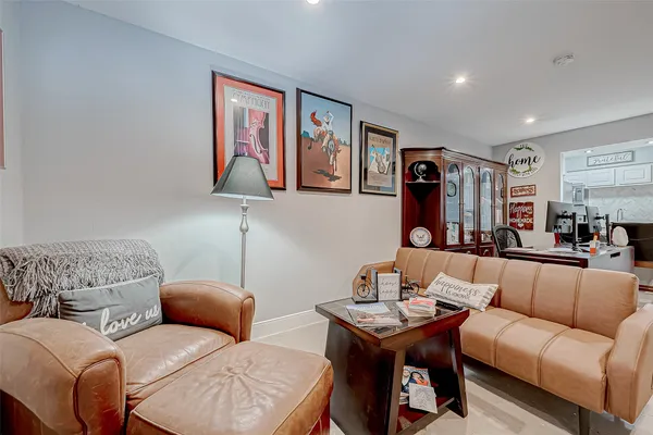 a living room with a fireplace and a flat screen tv