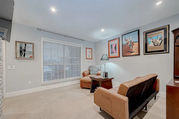 a bedroom with furniture and a window