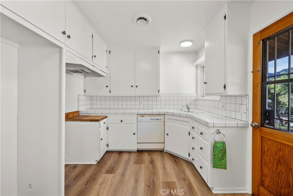 3318 Prospect Avenue La Crescenta, CA 91214 - Photo 15 of 42 a kitchen with sink cabinets and window