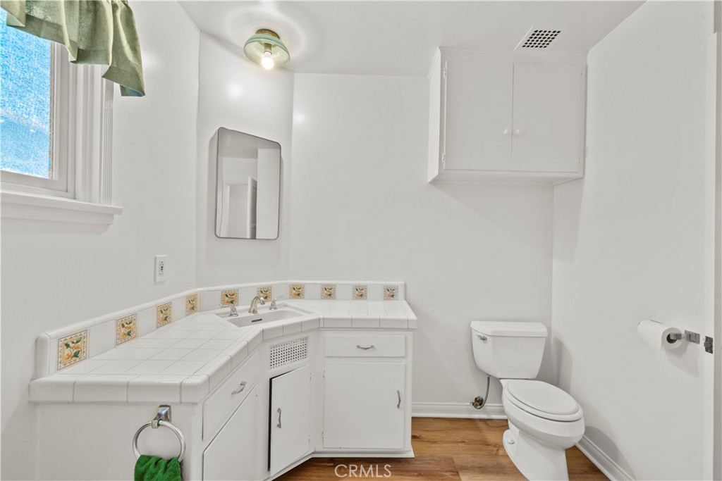 3318 Prospect Avenue La Crescenta, CA 91214 - Photo 24 of 42 a bathroom with a sink a toilet and a mirror