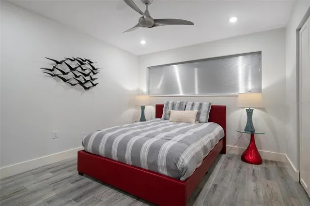 a bedroom with bed and window