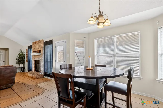a dining room with furniture and window