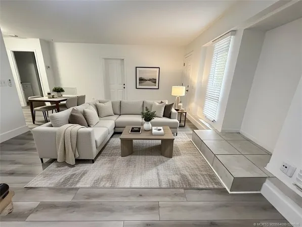 a living room with furniture and a couch