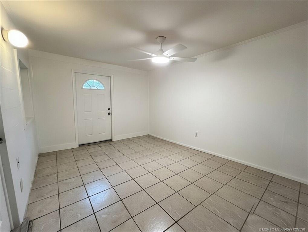 808 Southwest 33rd Street Palm City, FL 34990 - Photo 11 of 13 an empty room with windows