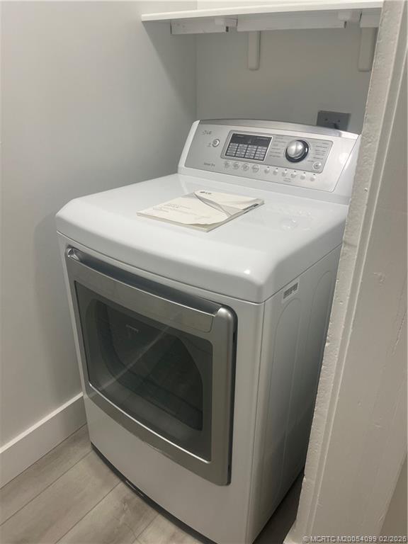 808 Southwest 33rd Street Palm City, FL 34990 - Photo 12 of 13 a utility room with washer and dryer