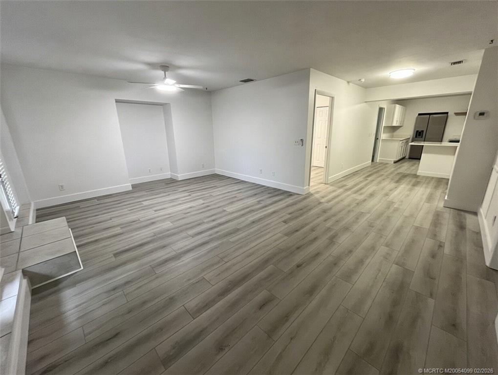 808 Southwest 33rd Street Palm City, FL 34990 - Photo 2 of 13 a view of a kitchen with wooden floor and electronic appliances