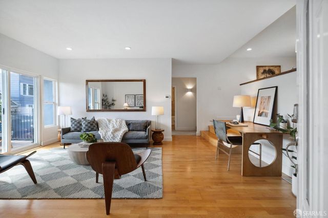 a living room with furniture and a table