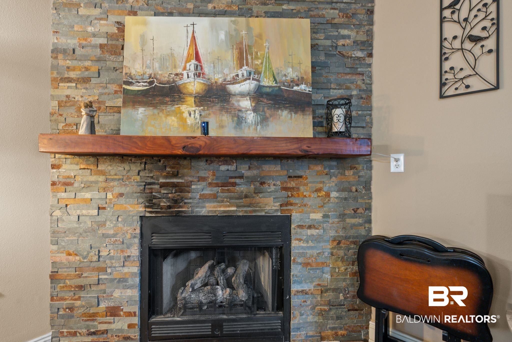 562 Vestige Mews Foley, AL 36535 - Photo 13 of 54 Stacked stone fireplace surround featuring a substantial wood mantel and integrated gas logs