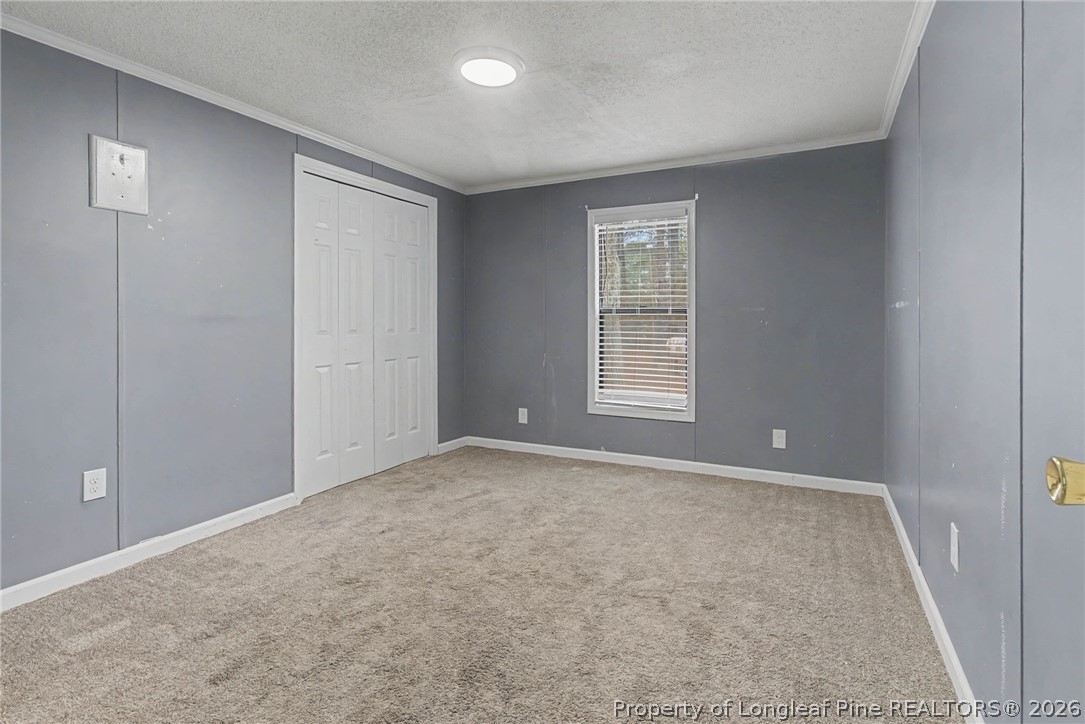 1512 Seabrook School Road Fayetteville, NC 28312 - Photo 10 of 30 an empty room with windows