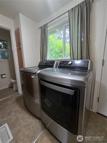a view of a kitchen with washer and dryer