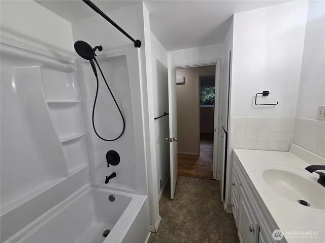 a bathroom with a sink a toilet and a bathtub