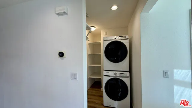 a view of a hallway with washer and dryer