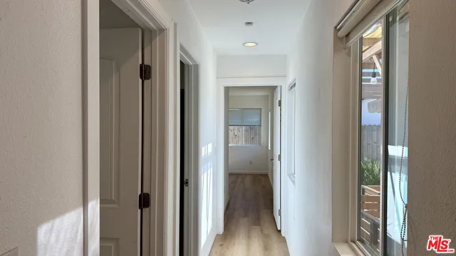 a view of a bathroom from a hallway