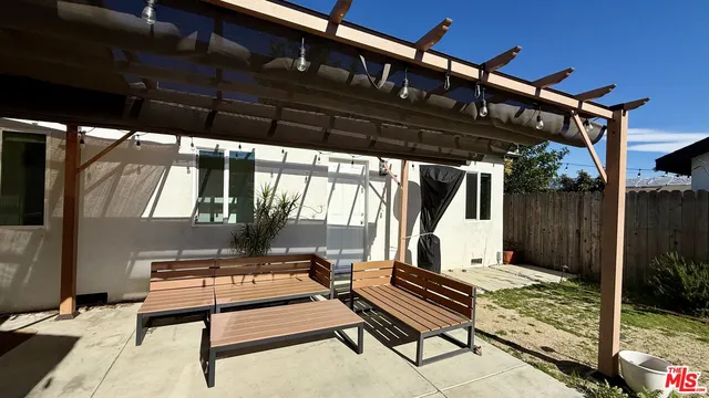 a view of backyard with a deck
