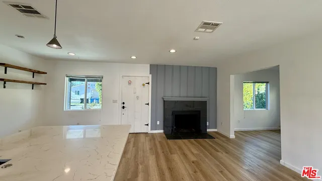 a view of livingroom and hardwood floor