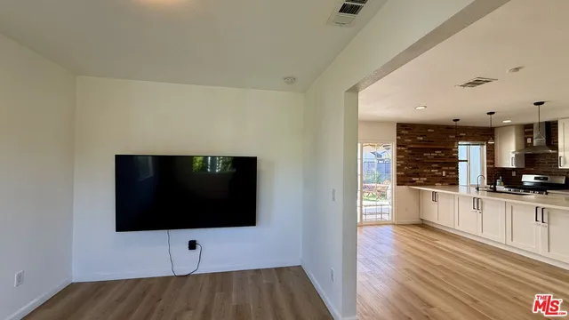 a view of kitchen with microwave and stove