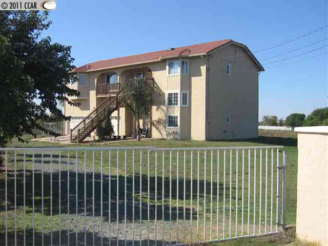 7115 Piper Road Bethel Island, CA 94511 - Photo 1 of 1 a view of a brick house with a large window