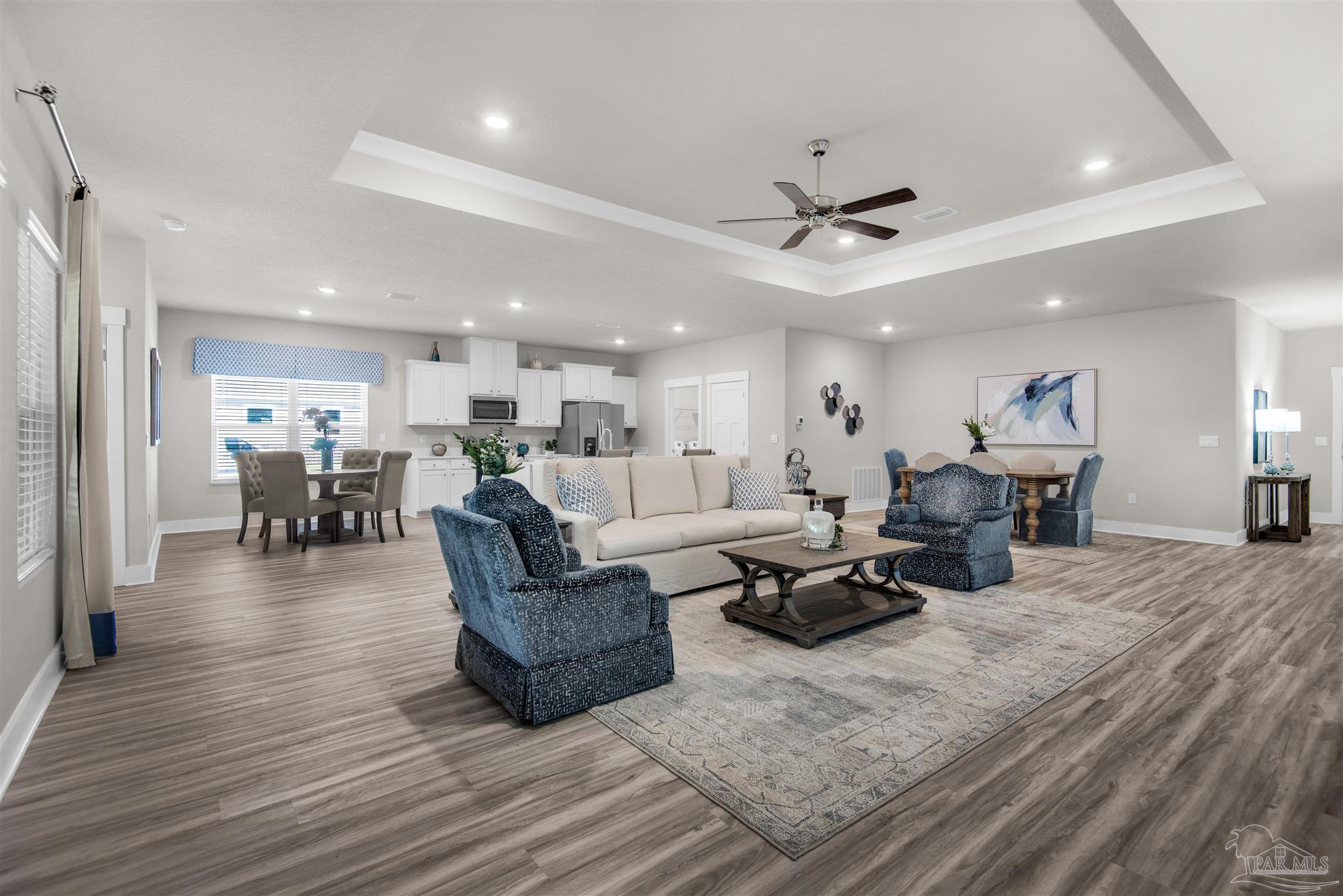 3287 Water Birch Road Cantonment, FL 32533 - Photo 19 of 45 a living room with furniture kitchen view and a wooden floor