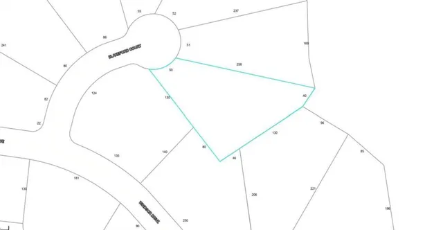 a view of a lake with a yard