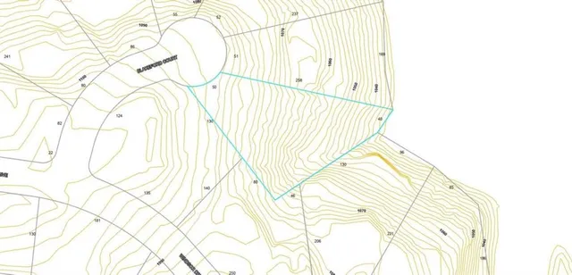 a view of a playground with a big yard