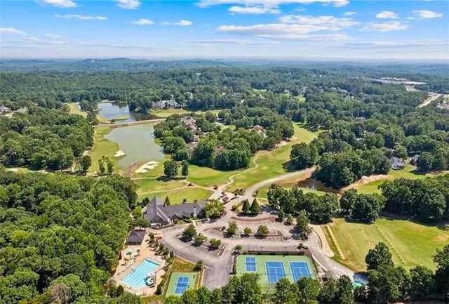 a dining room with furniture and chandelier kitchen view