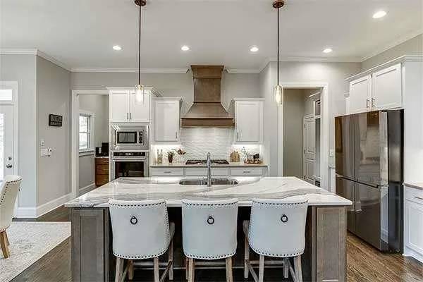 a kitchen with granite countertop a stove and a sink