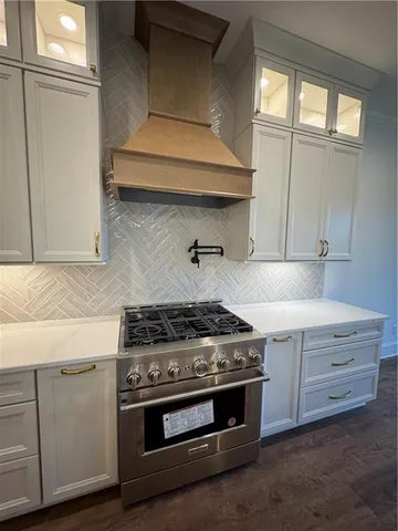 a view of kitchen with sink microwave and stove