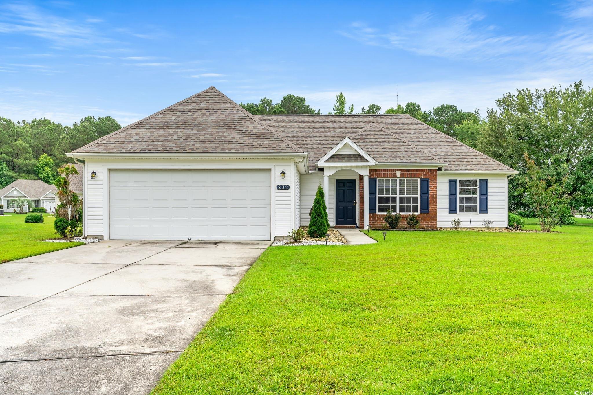 232 Marbella Drive Murrells Inlet, SC 29576 - Photo 1 of 40 View of front facade featuring a front yard, drive
