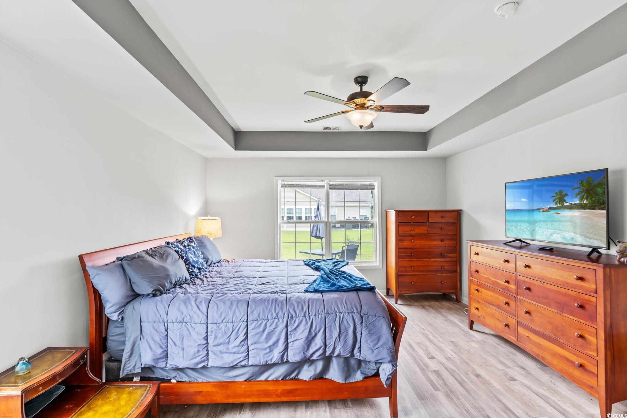232 Marbella Drive Murrells Inlet, SC 29576 - Photo 13 of 40 Bedroom featuring light wood-type flooring, a tray