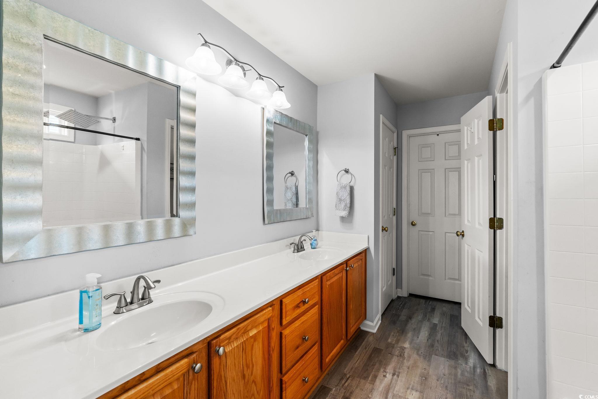 232 Marbella Drive Murrells Inlet, SC 29576 - Photo 15 of 40 Full bathroom featuring wood finished floors, a ti