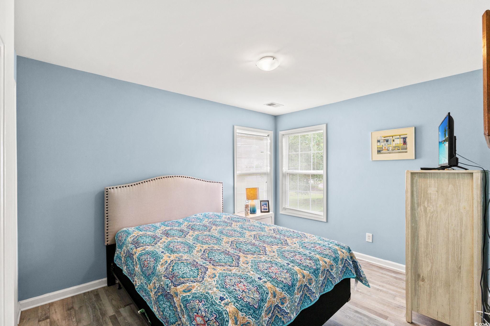 232 Marbella Drive Murrells Inlet, SC 29576 - Photo 17 of 40 Bedroom with baseboards and wood finished floors