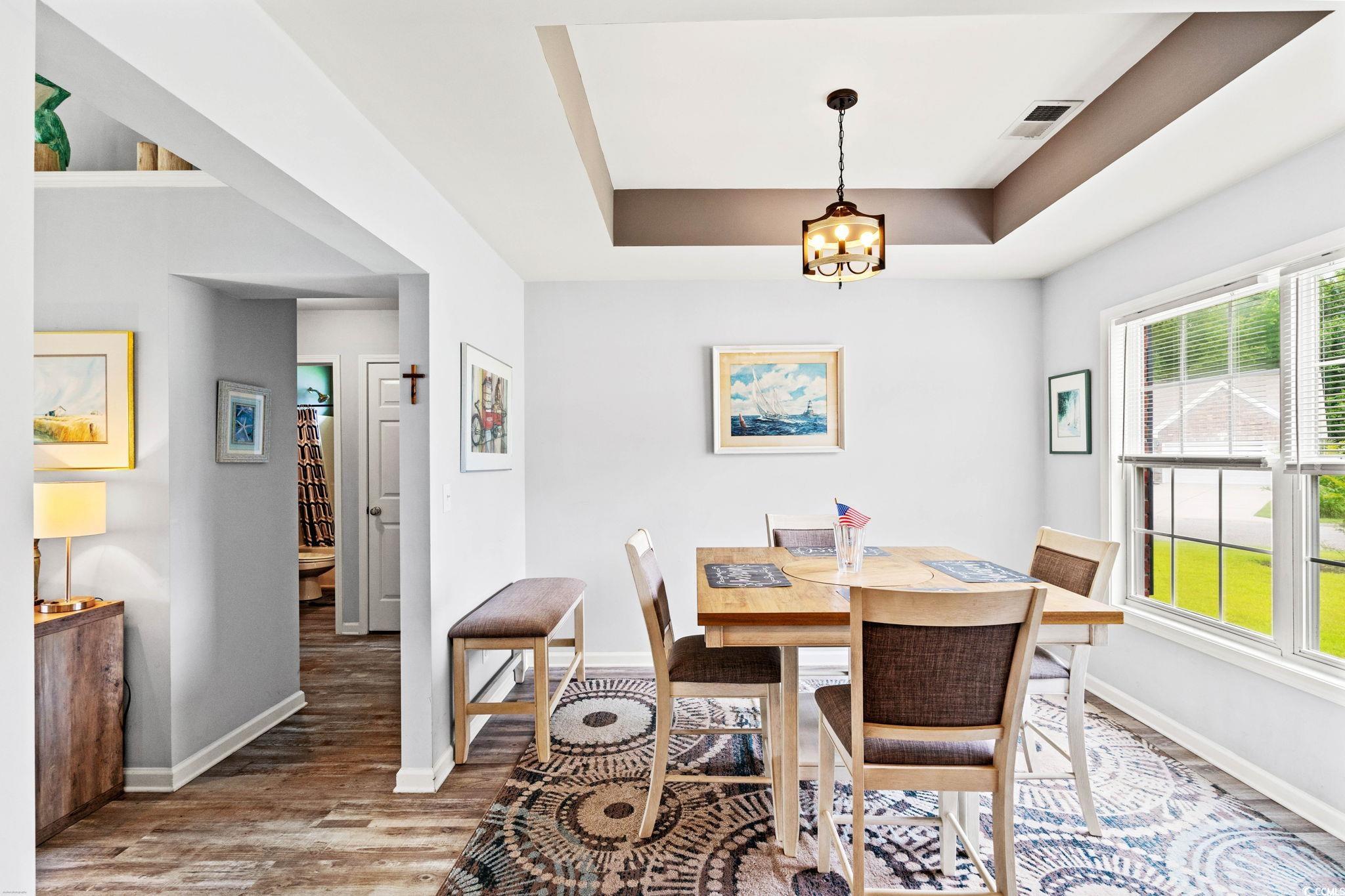232 Marbella Drive Murrells Inlet, SC 29576 - Photo 4 of 40 Dining space with wood finished floors, plenty of