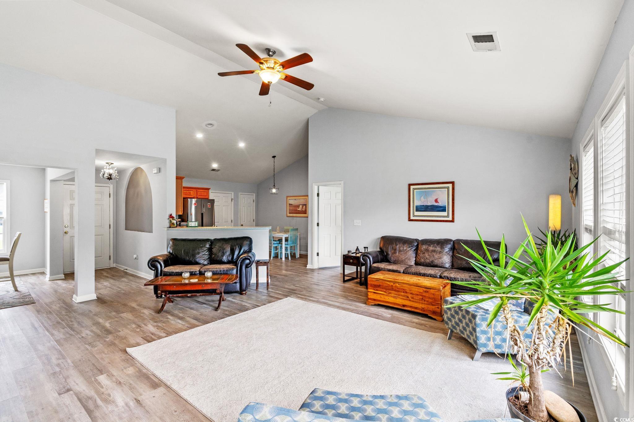 232 Marbella Drive Murrells Inlet, SC 29576 - Photo 9 of 40 Living area with a ceiling fan, high vaulted ceili