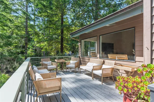 a view of backyard with a patio and outdoor seating