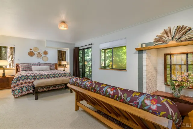 a bedroom with a bed and a couch