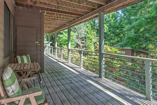 a view of balcony with furniture