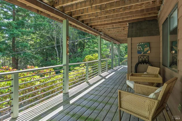 a view of a balcony with chairs