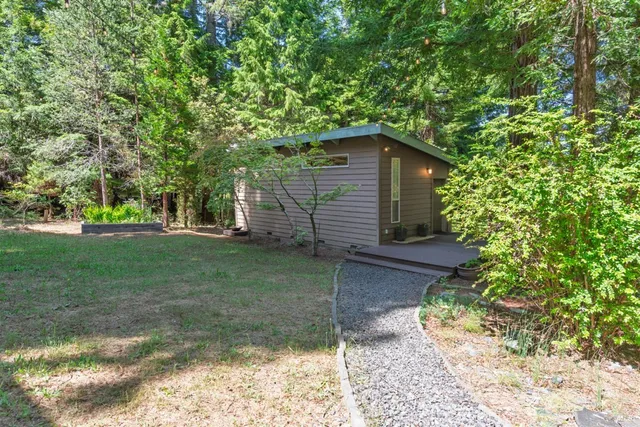 a backyard of a house with lots of green space