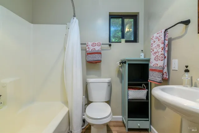 a bedroom with a bed and a fireplace