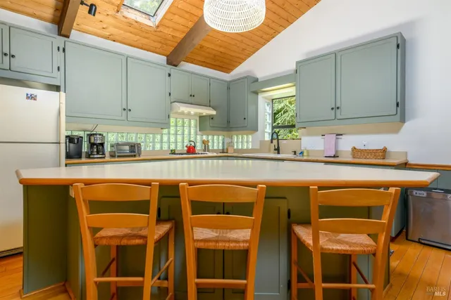 a kitchen with a sink cabinets and window