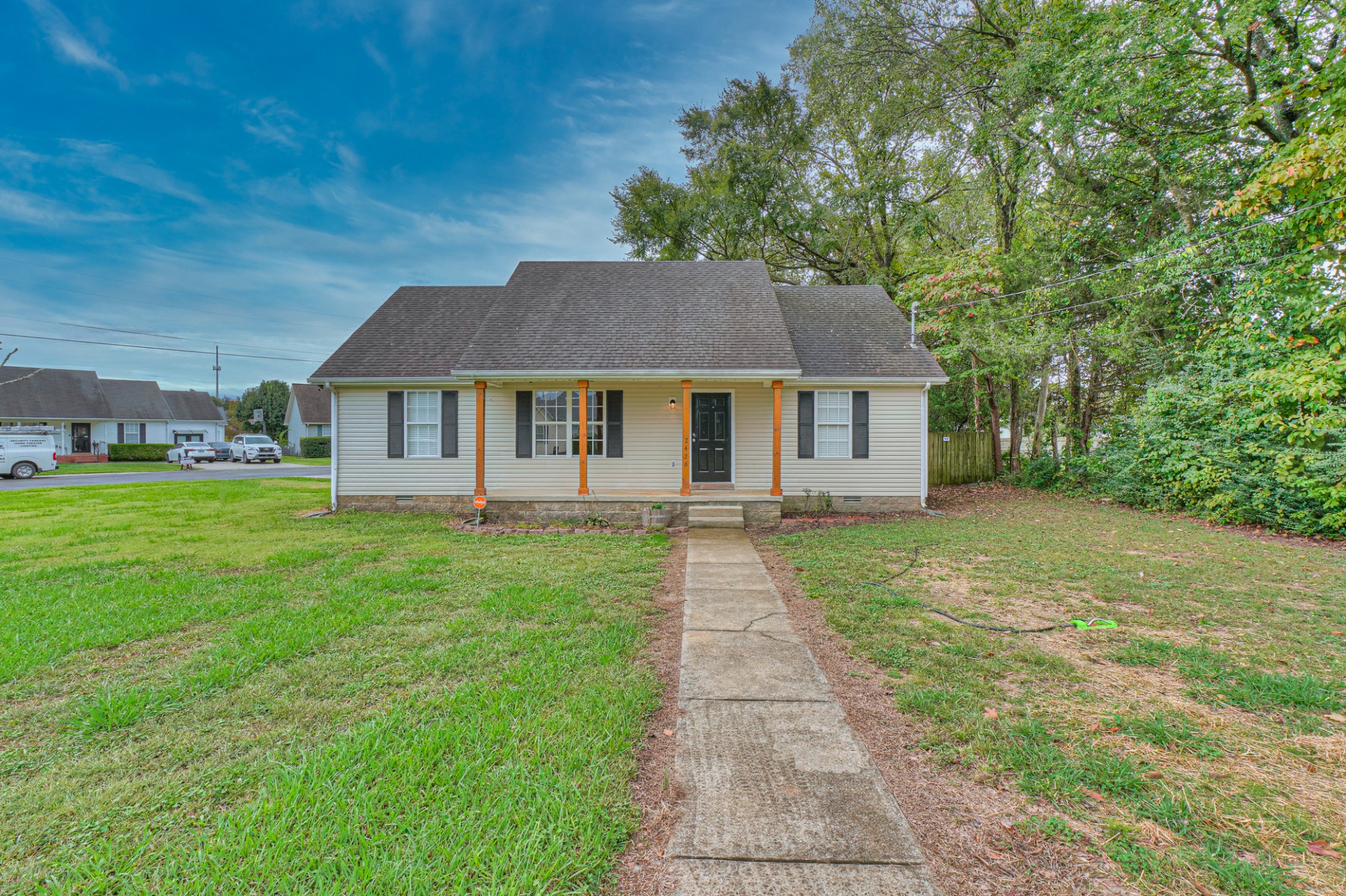 a front view of a house with a garden